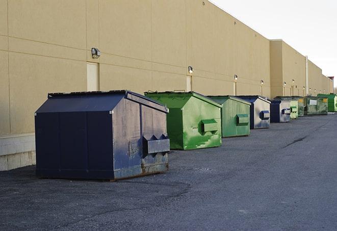 an arrangement of durable and robust disposal containers utilized on a construction project in Comstock Park